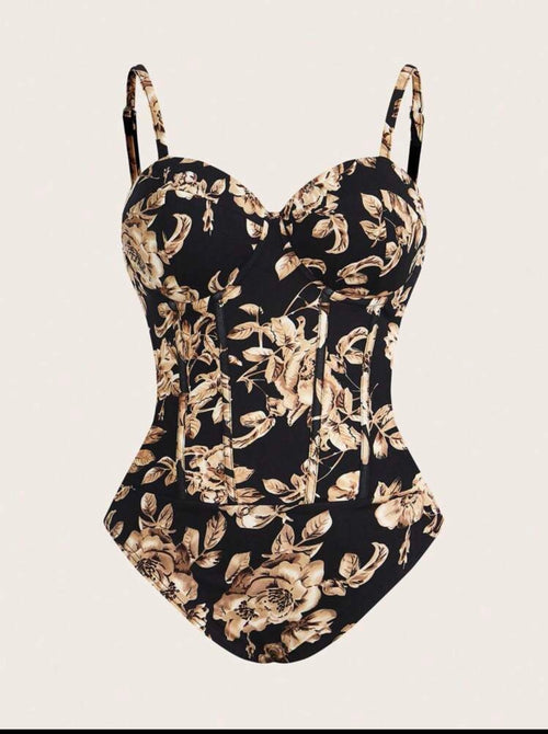 Black corset top with gold floral print and structured fit